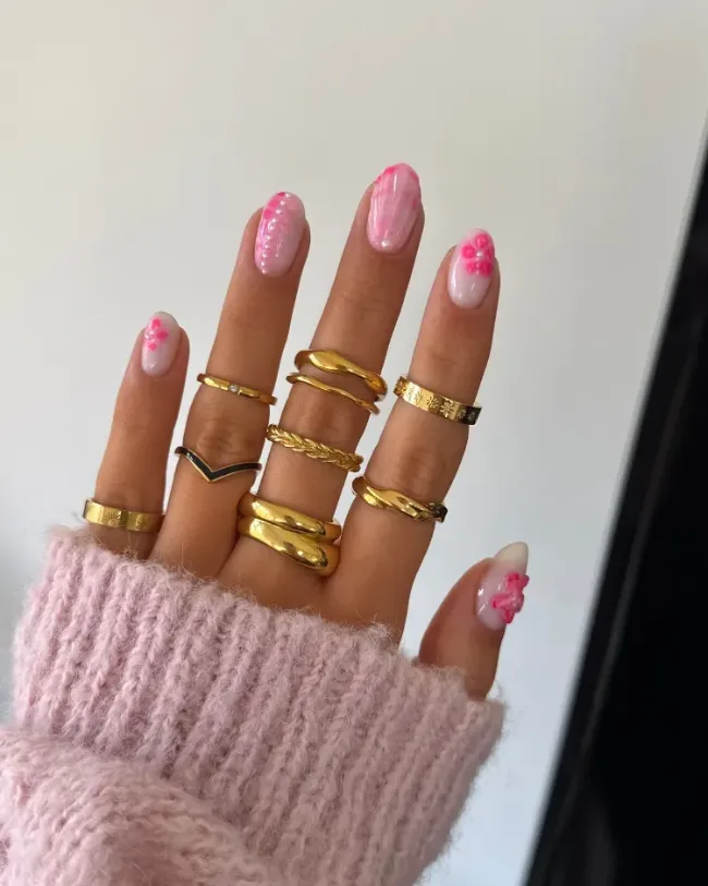 Soft pink floral nails with glossy finish