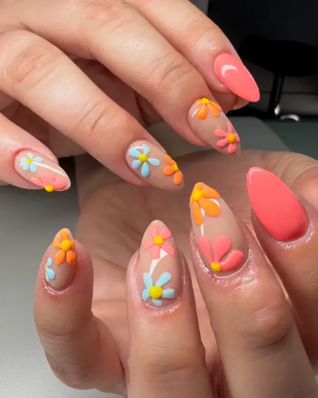 Bright daisy nails in coral and yellow