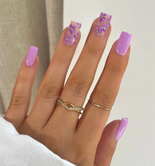 Lavender nail design with petite floral accents