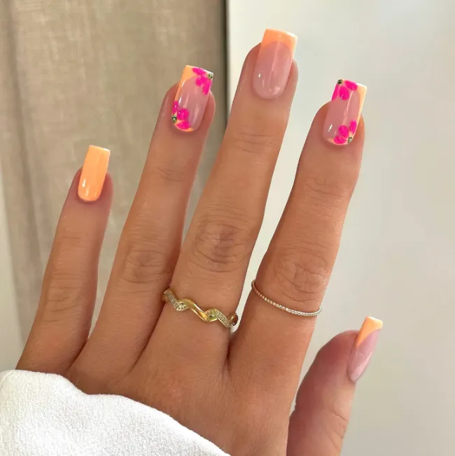 Peach ombre French tips with petite floral accents