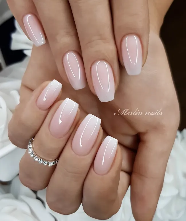 Nude square nails with crystal crescent accent