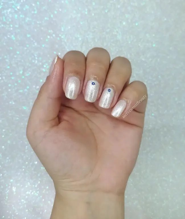 Champagne shimmer nails with tiny gem accents