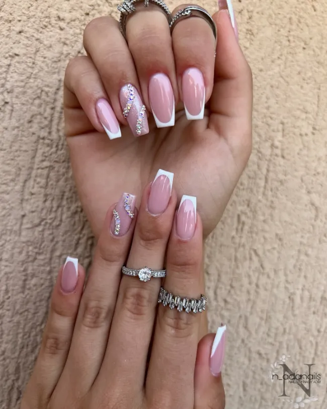 French tip nails with crystal swirl design