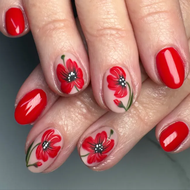 Red flower nail design on nude base